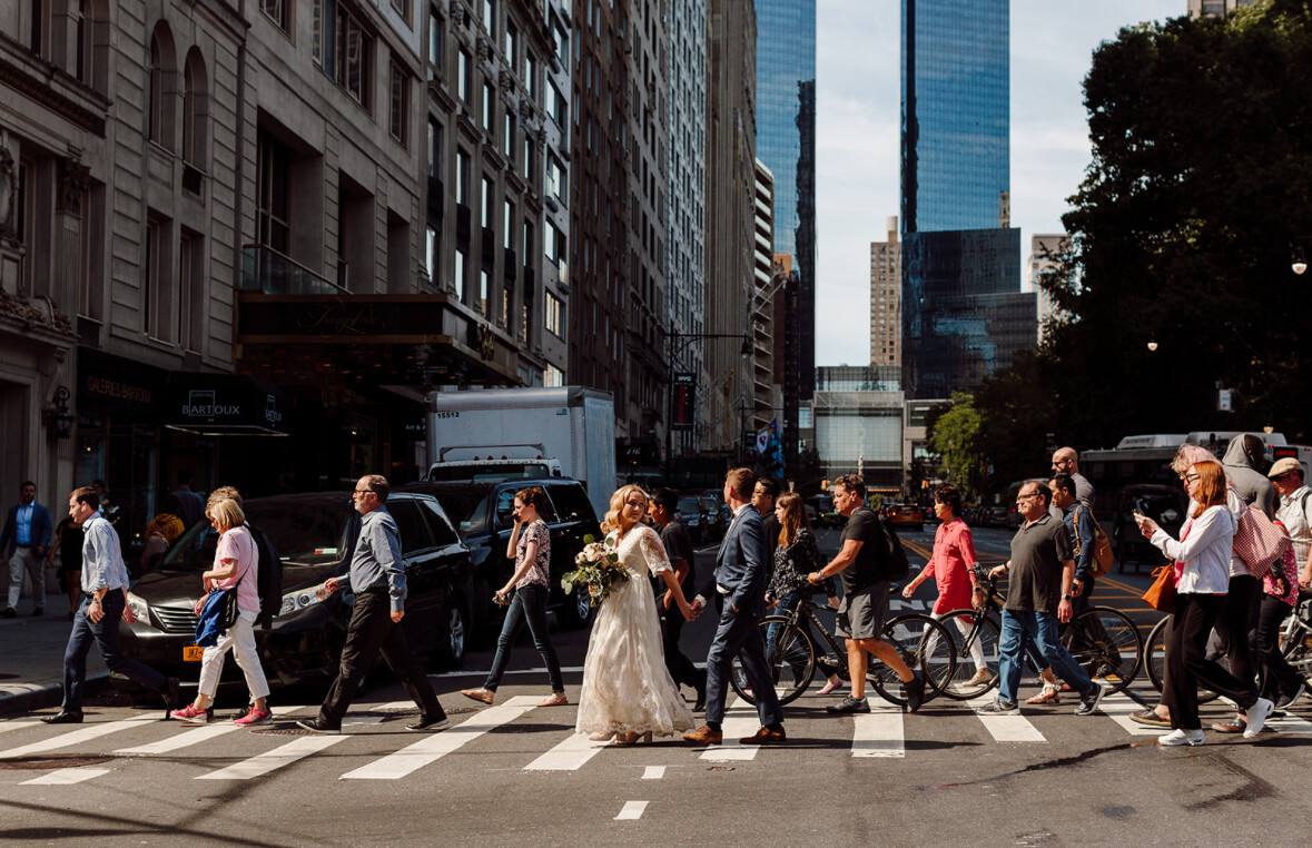 Wedding party crossing the road with iconic New York street behind